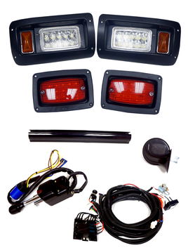 Complete kit. Headlights, tail lights, steering column shroud, turn signal switch, horn, and wiring harness for the light kit. 