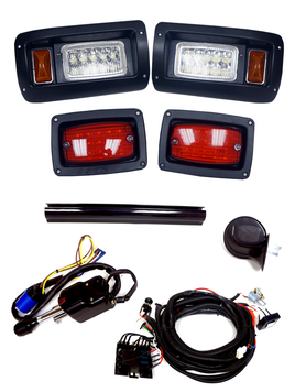 Complete kit. Headlights, tail lights, steering column shroud, turn signal switch, horn, and wiring harness for the light kit.